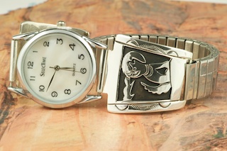 Beautiful Sterling Silver Watch Tips with Howling Wolf Design. Mens quartz watch with expandable band. Created by Navajo Artist Tommy Singer. Signed.